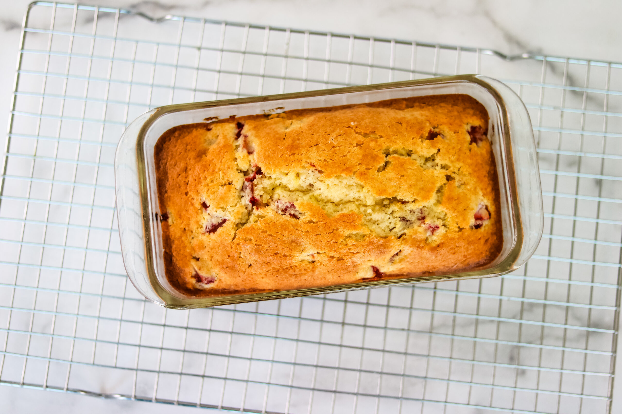 Strawberry-Quick-Bread-Cooked-in-pan-on-cooling-rack