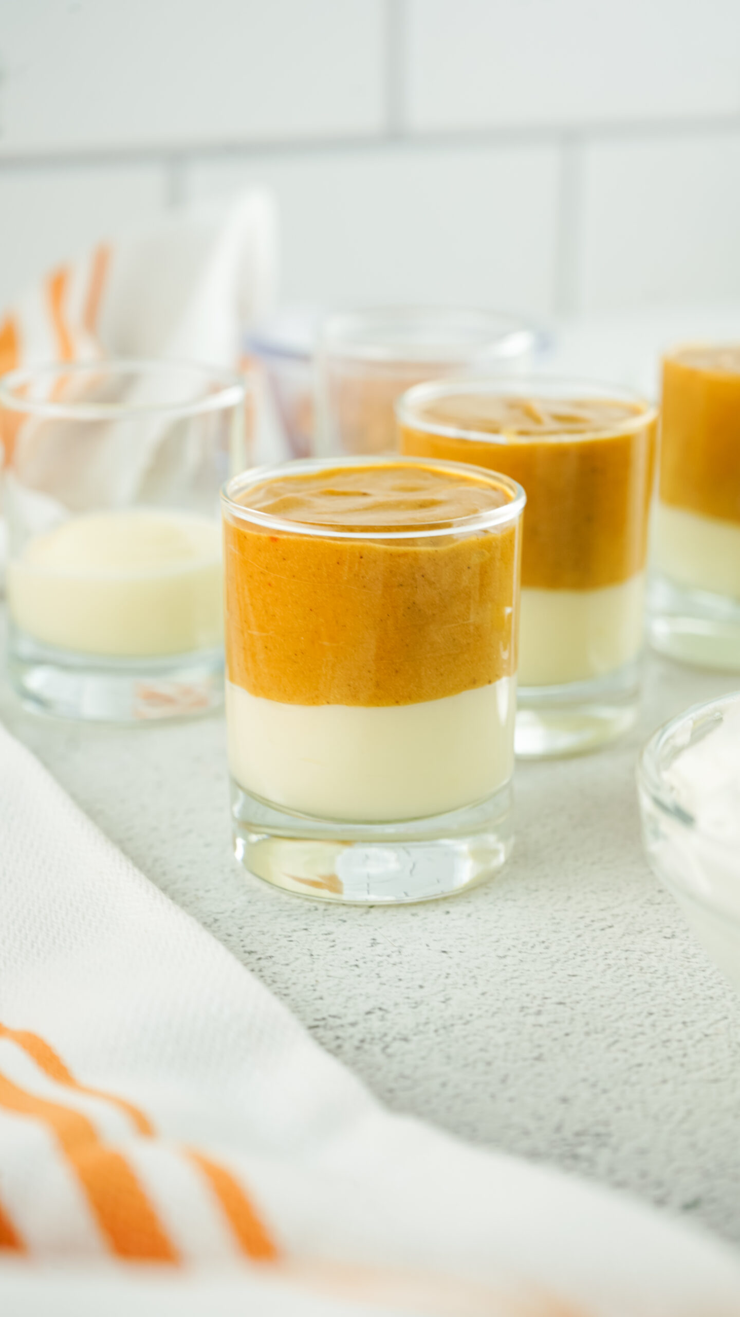 Pumpkin-Cheesecake-Pudding-shots-add-pumpkin-mix-to-shot-glass