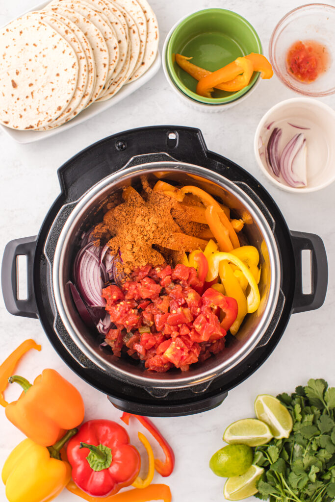  Instant-Pot-Steak-Fajitas-Add-tomatoes-and-taco-spices