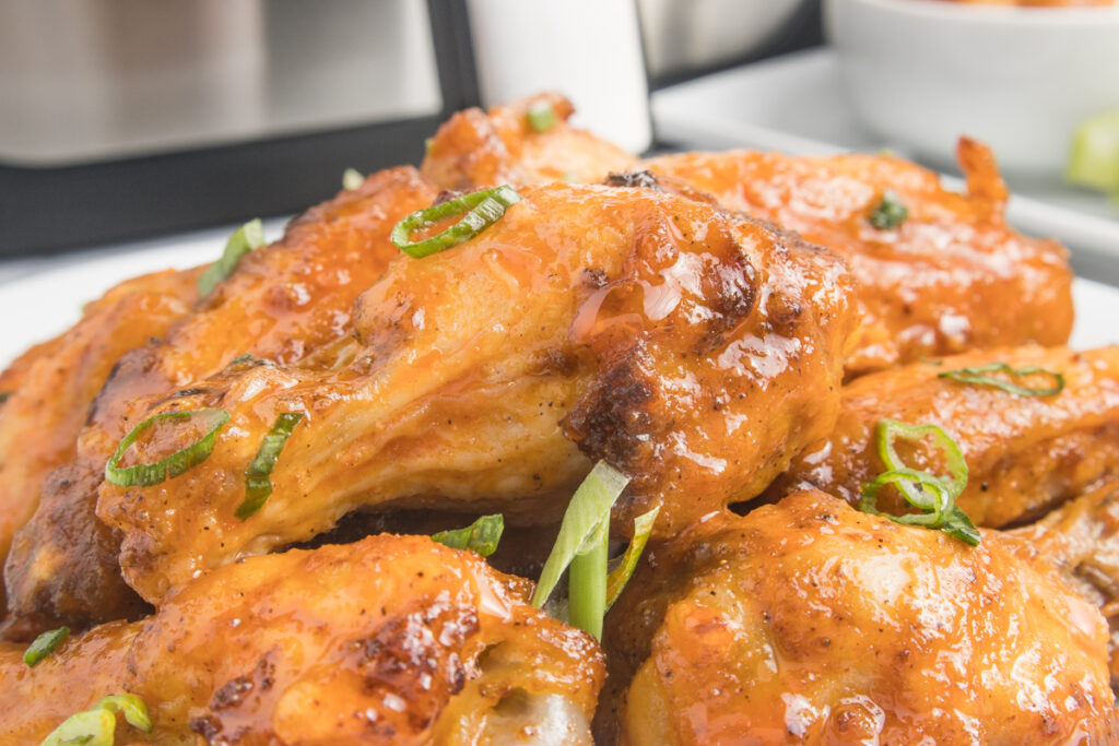 Air-Fryer-Buffalo-Chicken-Wings-closeup-wings-on-a-white-plate